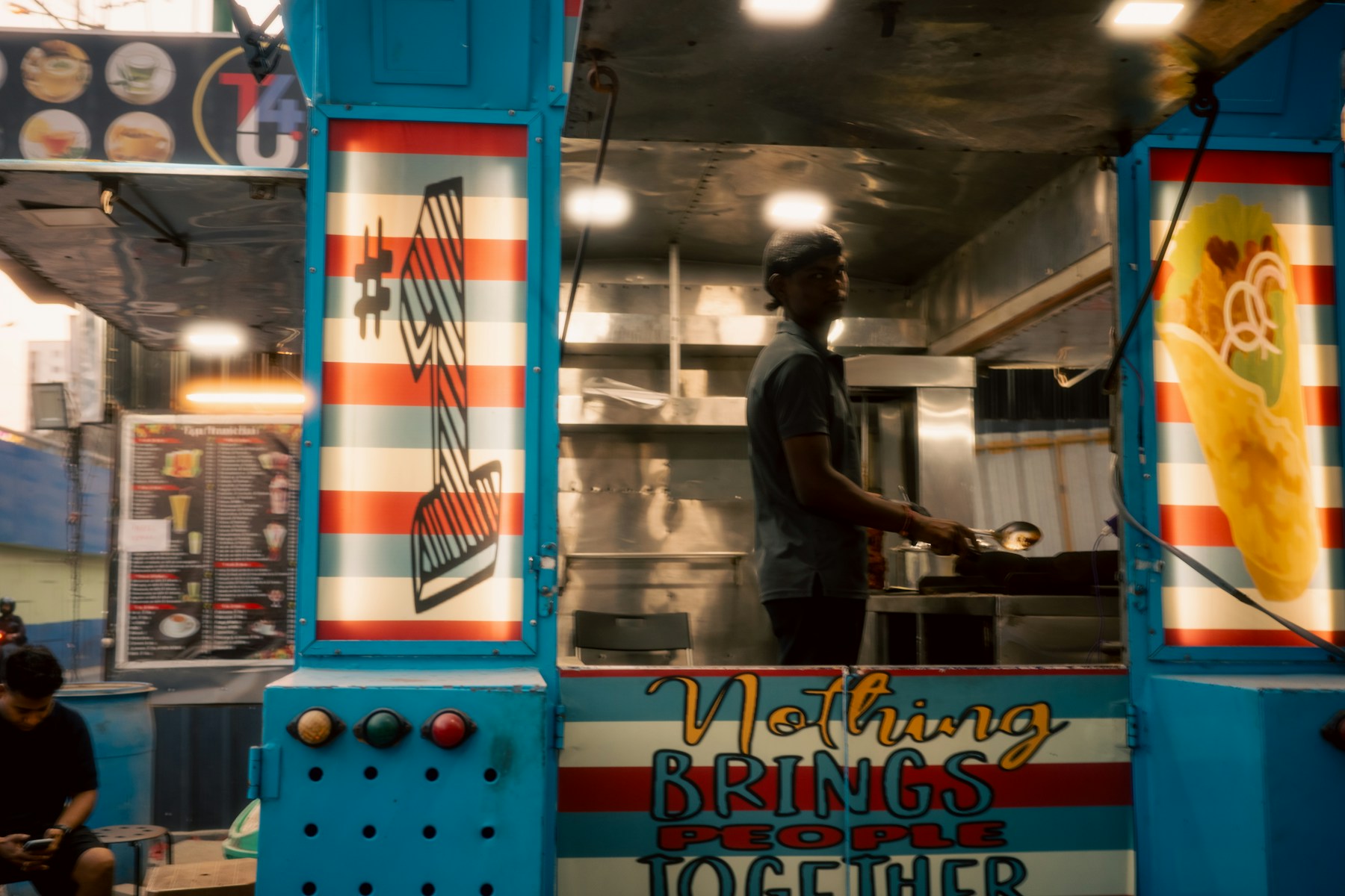 Colorful mobile food truck serving customers outdoors